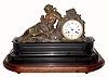 C.1870, French, Bronze and Marble Figural clock, ÒReclining HarvestÓ with a sickle in one hand and a sheaf of wheat in the other hand, 8-day time and strike. 