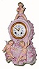 C.1890, German, Lenzkirch, Porcelain china clock with 3 dimensional leafy applique; musical themes, the winged cherub at top playing a flute, and a pair of cherubs frolicking below the dial. 