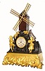 C.1880, French, Automaton Figural clock, the dial marked LeRoy, Paris, with a windmill powered by a separate movement in the base, and a bag-piper piping while a costumed girl to the right is dancing, and behind a silvered goat is eating flowers.