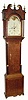 C.1825, English, 30-hour Painted Dial tall clock with rolling moon, oak case with broken arch hood. 