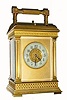 C.1900, French, Brass Cased Carriage clock, 8-day, time, strike and repeat, in a stylized case with square columns, and embossed bands across the top and bottom of the case, plus the dial center, the whole with original gilding. 