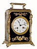 C.1905, French, Ormolu and Ebonized wood mantel clock, with female caryatids at the corners, with pivoted pendulum and bell strike, 8-day. 