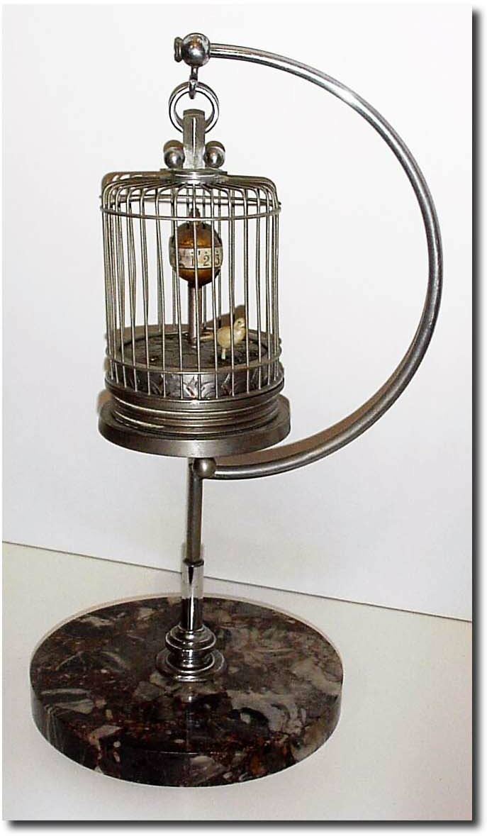 C.1950, German, Rocking Bird in Cage, with chrome stand on a marble base. — Antique Clocks Price Guide