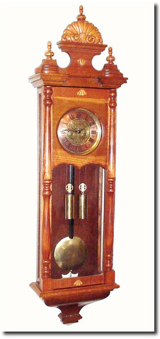Mixed lot: A circa 1890 German Vienna style wall regulator, with new top and new door (with modern pressed trims), and the case refinished, the movement now with Waterbury style hands. — Antique Clocks Price Guide