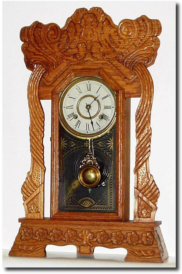 C.1905, New Haven Clock Co., "Norwich Linen" model pressed oak gingerbread in excellent original condition. — Antique Clocks Price Guide