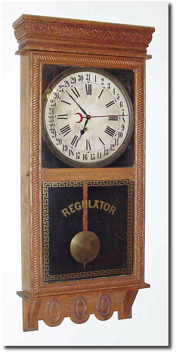 C.1910, Ingraham "NORTHWESTERN', oak store regulator with calendar. — Antique Clocks Price Guide