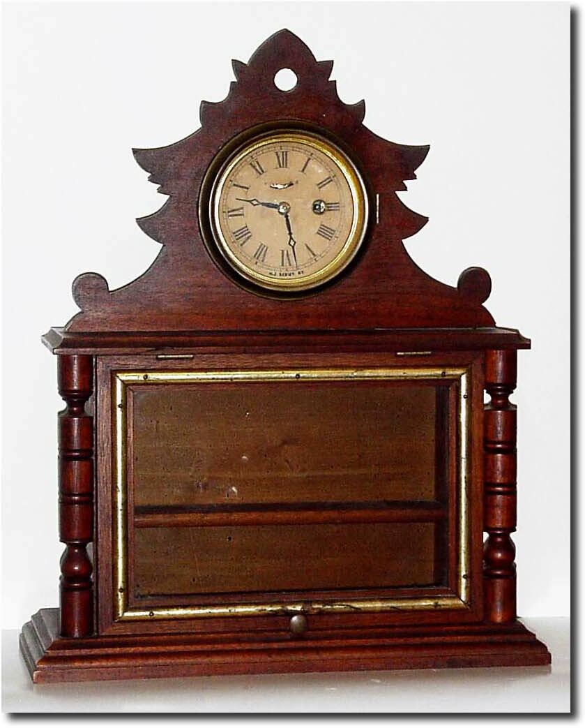 C.1875, H.J. Davies, New York (signed on movement), novelty walnut "shaving' clock in very good condition. — Antique Clocks Price Guide