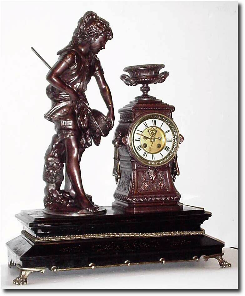 C.1890, French, Bronzed Spelter Figural Clock of a girl fishing with a net. — Antique Clocks Price Guide