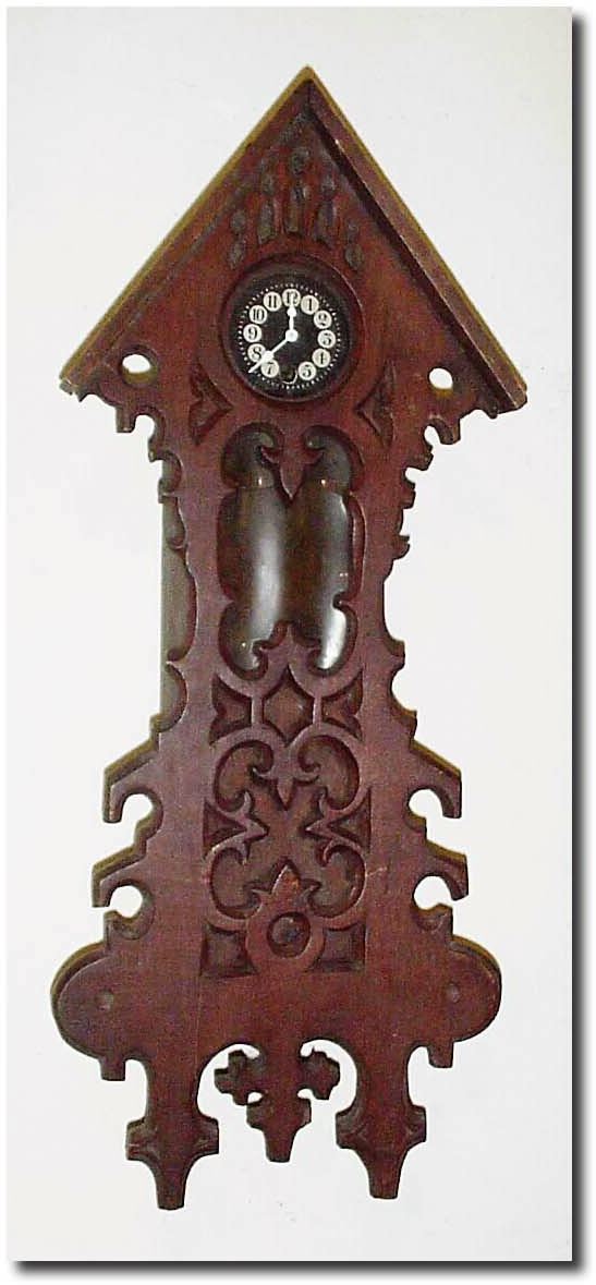 C.1930, German, Black Forest Mini Wall clock, in a carved architectural case, now without roof trim, and very dirty. — Antique Clocks Price Guide