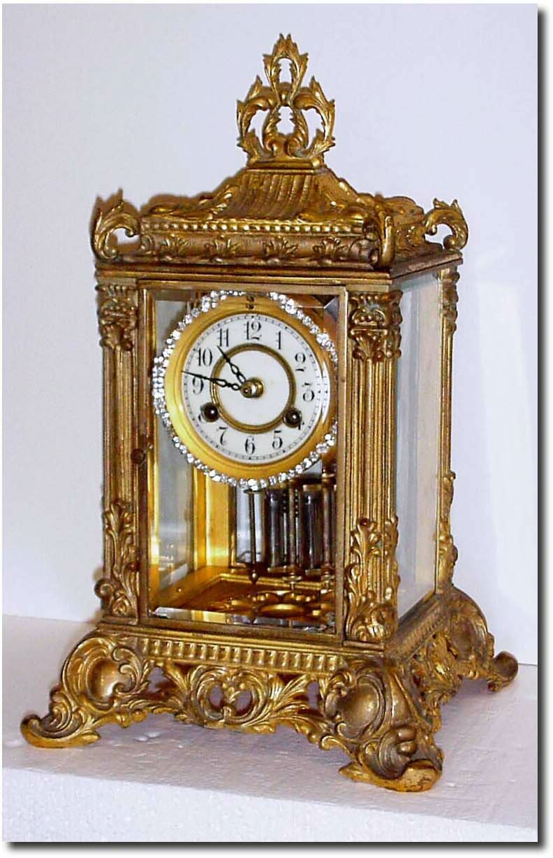 C.1905, Waterbury "RENNES' Fancy Crystal regulator with optional brilliant ring sash, this model with solid two piece dial. — Antique Clocks Price Guide