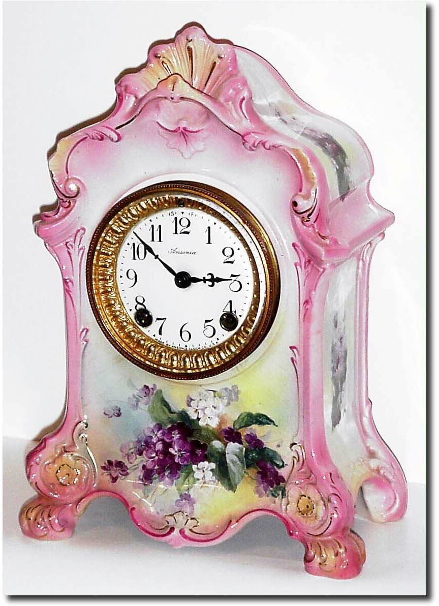 C.1905, Ansonia "La Farge" Porcelain China clock in light pink with mixed white and lavender violets on a pale yellow background, and in perfect original condition. — Antique Clocks Price Guide