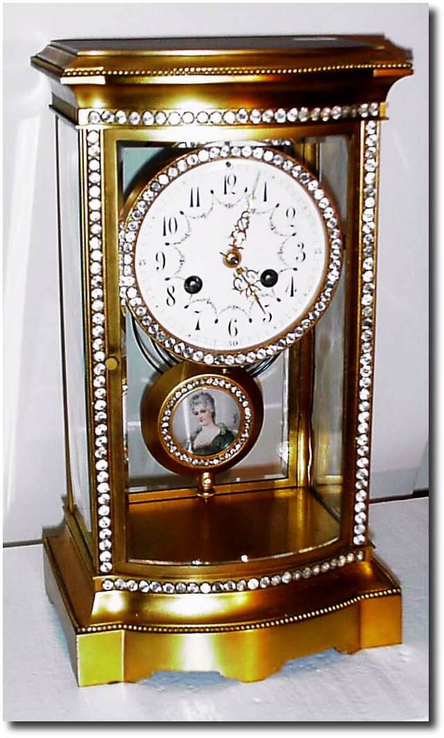 C.1900, French, Bow Front Crystal Regulator with brilliants around the case, dial and pendulum. — Antique Clocks Price Guide