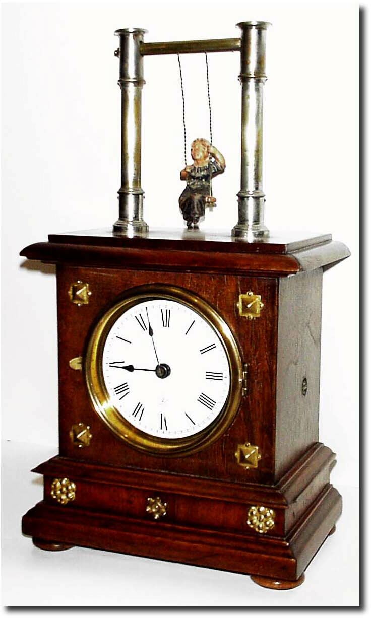 C.1910, German, Junghans, Swinging Doll clock in very good original condition. — Antique Clocks Price Guide