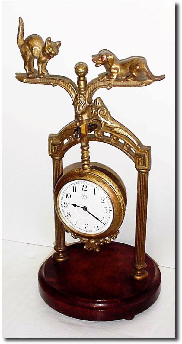 C.1910, German, Junghans, extremely rare "Dog and Cat' swinging arm clock. — Antique Clocks Price Guide