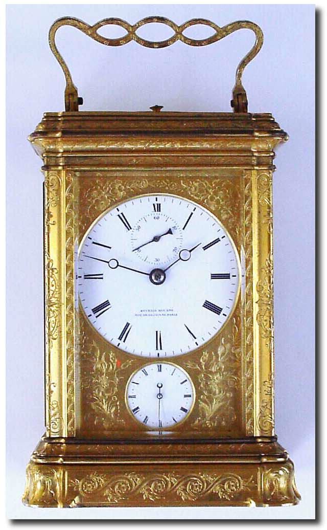 C.1900, French, Brass Cased Carriage Clock, Grand Sonnerie with repeat and alarm, by A.E. Bourdin, both the dial and the shuttered back signed "Bourdin, Her Brevete, Rue de la Pais 28, Paris' This has a wonderful engraved gorge case, nicely off set by a unique pierced and engraved handle. — Antique Clocks Price Guide
