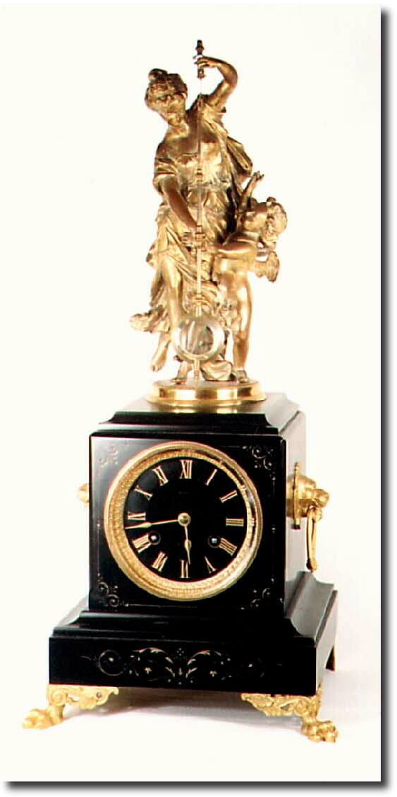 C.1880, French, "Mystery' Clock with gilded spelter statue and crystal pendulum in restored condition, the statue with evidence of an old repair to ladies leg. — Antique Clocks Price Guide