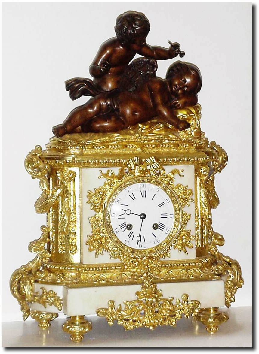 C.1830, French, Ormolu and Bronze Figural clock, a young boy with flute watching over a winged cherub at rest. — Antique Clocks Price Guide