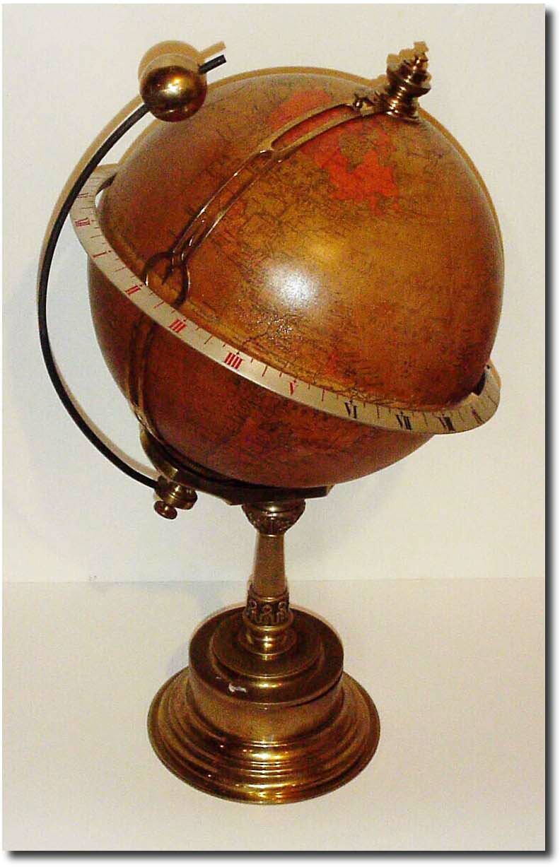 C.1890, French, for S. Smith and Sons, London, a globe clock, complete with a movable sun and local time pointer. — Antique Clocks Price Guide