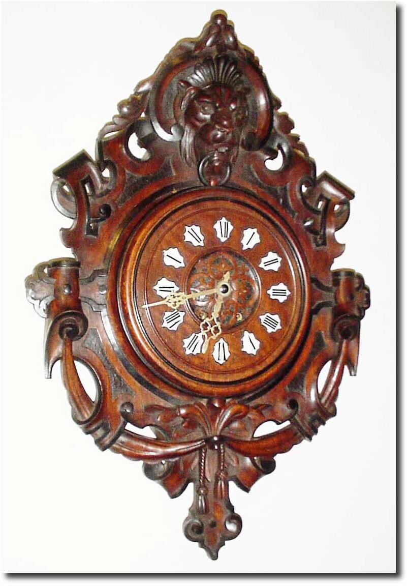 C.1890, French, Walnut cartel clock with carved lion at top and ribbons and scrolls at the bottom. — Antique Clocks Price Guide