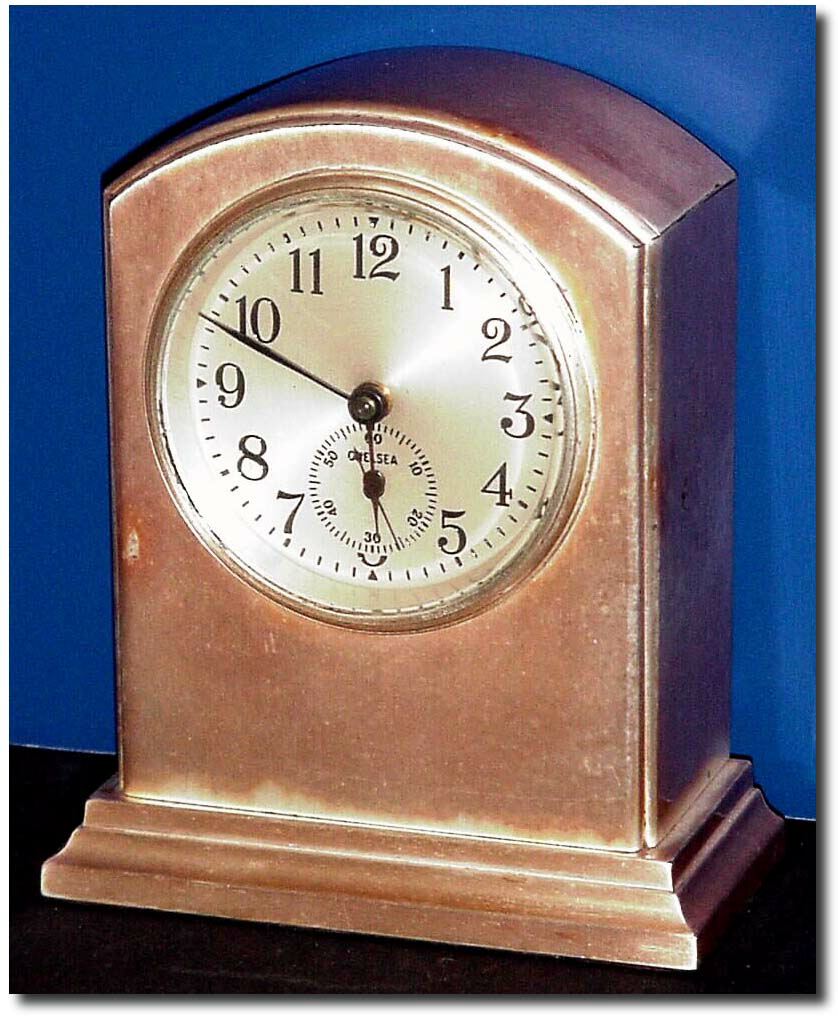 C.1920, Chelsea Clock Co., a nice small desk timepiece in a bronze case that was silvered later, and with some tarnish. — Antique Clocks Price Guide