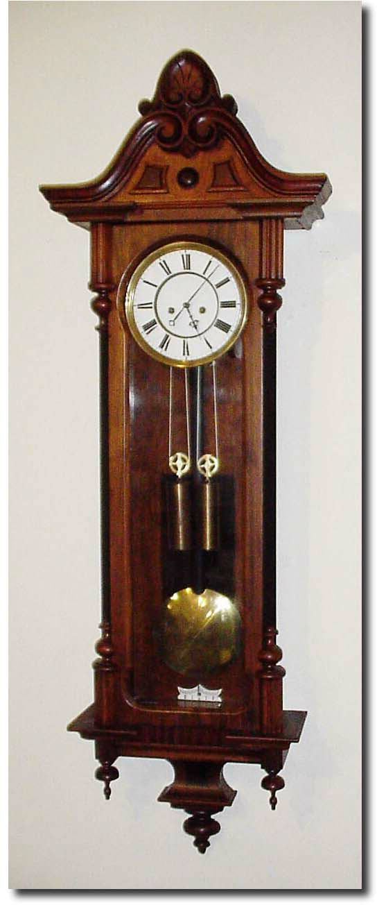 C.1875, Austrian, 2-Weight "Vienna Regulator' in a walnut case, with restorations. — Antique Clocks Price Guide