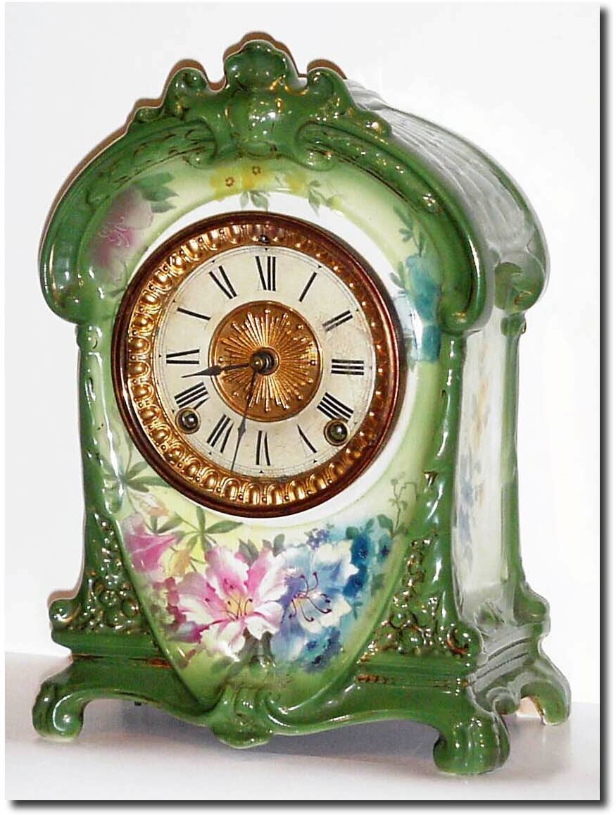 C.1900, Ansonia Royal Bonn "La Cruz' Porcelain china clock in excellent original condition, with good paper dial with gilt center. — Antique Clocks Price Guide