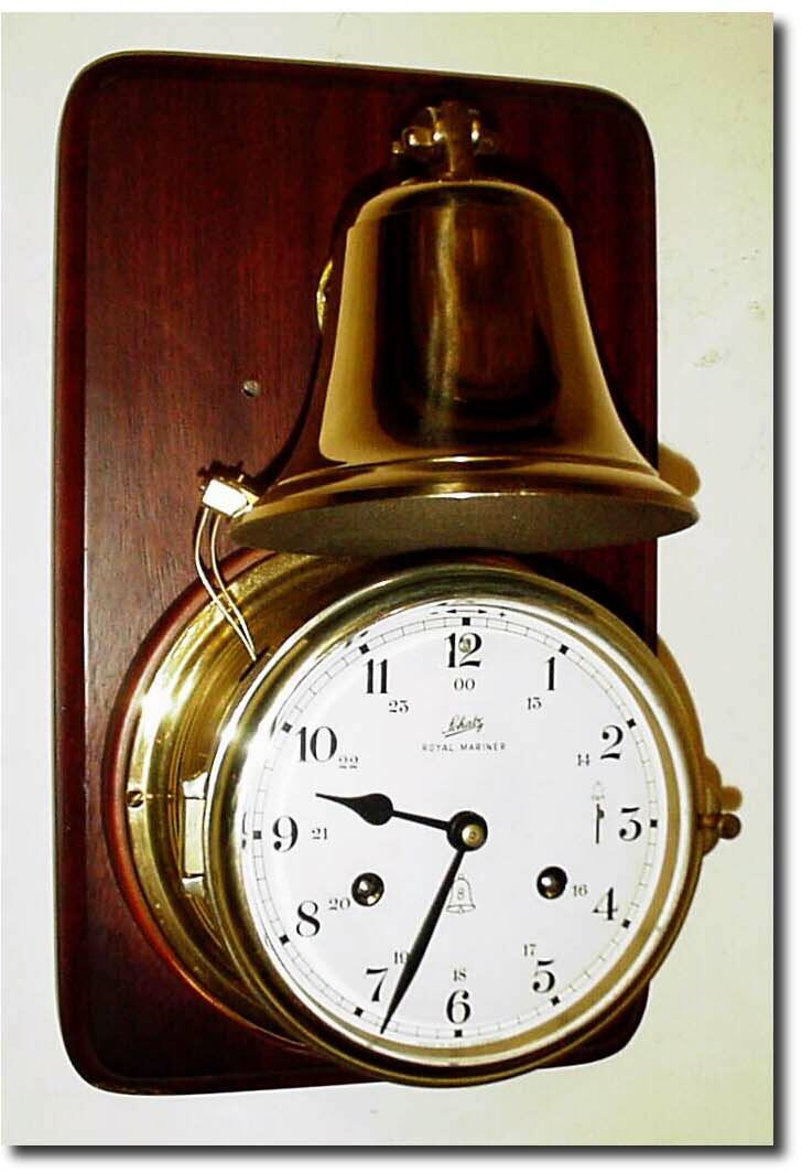 C.1955, German, Schatz, "Royal Mariner' Ship"s Bell clock with full size external bell, mounted on original chip-board board with mahogany veneer. — Antique Clocks Price Guide