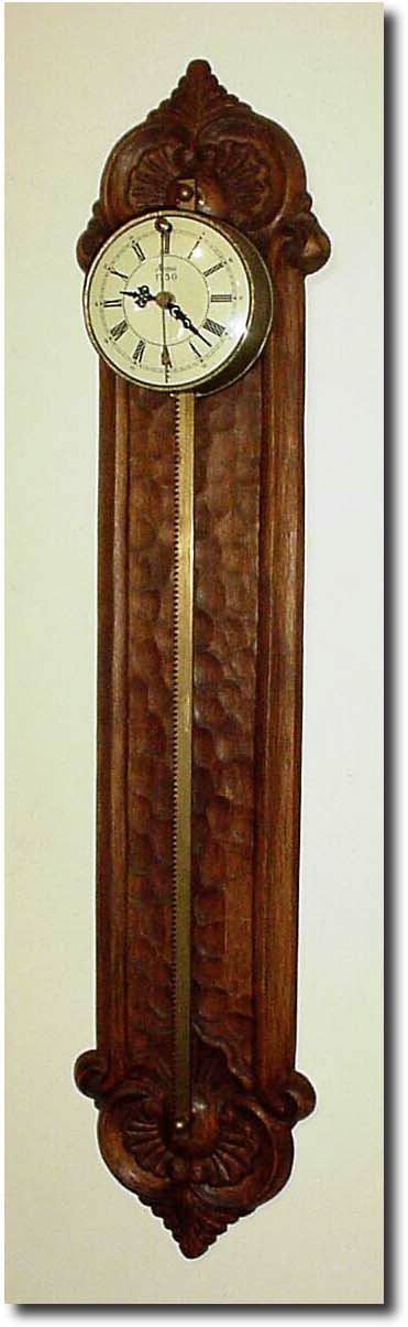 C.1975, German, Gravity Clock, Wall mount with front swinging cow"s tail pendulum; reproduction of a 16th Century model. — Antique Clocks Price Guide