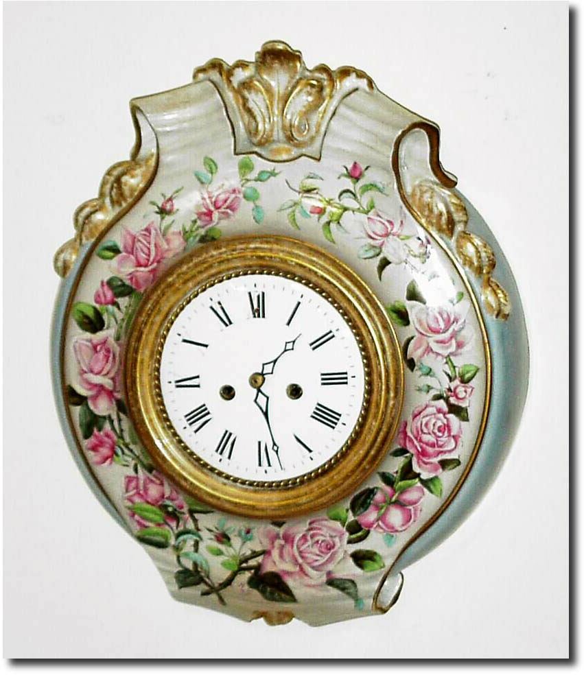C.1880, French, a Porcelain Cartel Clock with pink and white roses, the art work signed by "M.G.', now with a C.1840 French silk thread time and strike movement with dial (fits well). — Antique Clocks Price Guide