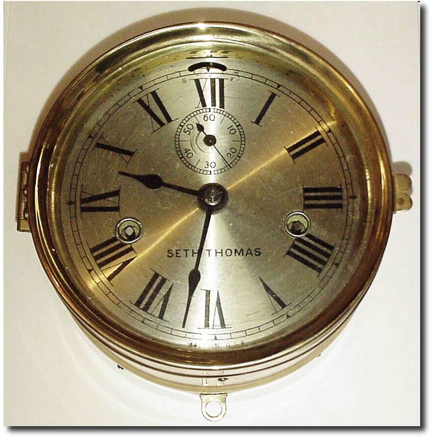 C.1910, Seth Thomas, Engine Lever, in smooth brass case with wooden backboard and most of the original label. — Antique Clocks Price Guide