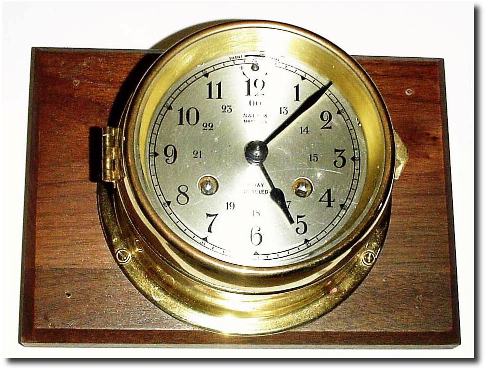 C.1965, German, "Sale m' Ship"s Bell striking wall clock, mounted to a rectangular piece of walnut. — Antique Clocks Price Guide