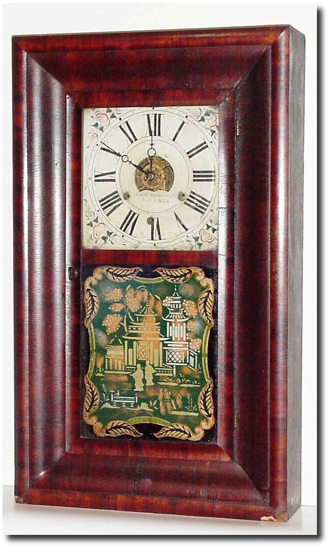C.1850, Forestville Mfg., Bristol, Conn, 30-hour OOG with time, strike and alarm between the plates (3-weight). — Antique Clocks Price Guide