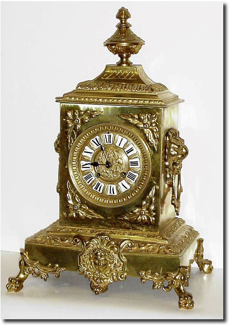 C.1890, French, Cast Brass mantel clock, in architectural form with a bust of Diana below the dial and the sides with lion busts with brass rings from their mouths. — Antique Clocks Price Guide