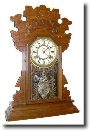 C.1895, Waterbury "NORWALK" walnut time and strike mantel clock — Antique Clocks Price Guide