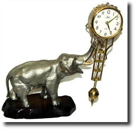 C.1970, Japan, Fuji Clock Co., 8-Day swinging mystery timepiece — Antique Clocks Price Guide