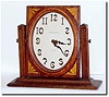 C.1925, Waltham Clock Co., a wonderful little mahogany desk clock with Art Nouveau styled hands and numerals (raised bronze).