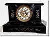 C.1890, New Haven "Fortuna', Black enamel over iron mantel clock.