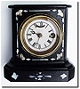 C.1860, L. Hubbell, Bristol, Conn, a mini black enameled iron clock, with mother of pearl, and in excellent restored condition.