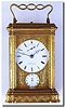 C.1900, French, Brass Cased Carriage Clock, Grand Sonnerie with repeat and alarm, by A.E. Bourdin, both the dial and the shuttered back signed "Bourdin, Her Brevete, Rue de la Pais 28, Paris' This has a wonderful engraved gorge case, nicely off set by a unique pierced and engraved handle.