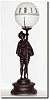 C.1885, French, Figural Night Clock, the 8-day platform movement in the base, driving the globe through the staff in the man"s hands.