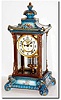 C.1914, Ansonia "Crystal Regulator No.2' in medium blue with yellow, pink and violet flowers, and with a winged cherub on the top.