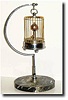 C.1948, Toyo Watch Co., Occupied Japan (signed movement), Bird-in-Cage, annular dial timepiece with original stand.