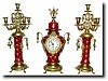 C.1900, French Red Porcelain and Bronze Clock Set with matching candelabra.
