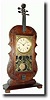A Late 20th Century reproduction of a Seth Thomas VIOLIN clock,