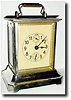 C.1900, Junghans carriage alarm clock with a music box in the base.