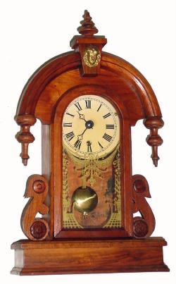 C.1975, Jim Davis, Greensboro, NC, miniature teardrop clock, walnut cased, with German 8-day movement. — Antique Clocks Price Guide