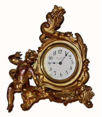C.1910, New Haven Clock Co., Boudoir novelty clock, 30 hour, gilt white metal case with porcelain dial. — Antique Clocks Price Guide