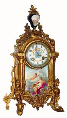 C.1890, French, Gilded Spelter mantel clock, with classic Renaissance lady with exposed bosom on painted and fired porcelain plaque, 8-day, time and gong strike. — Antique Clocks Price Guide