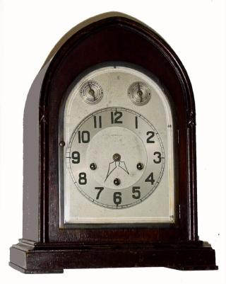 C.1923, Ansonia Clock Co., "Sonia No. 4", 8-day time/strike Westminster chime clock, with arched silvered dial with raised bronze numerals and subsidiary dials for F/S and chime/silent. — Antique Clocks Price Guide