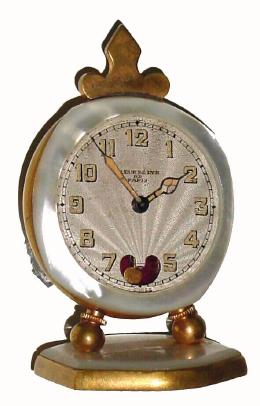 C.1920, Swiss for Fleur de Lys de Paris, little "Heartbeat" clock with MOP bezel. — Antique Clocks Price Guide